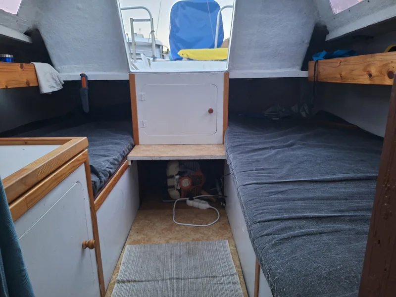 Cabin interior with storage under the berths