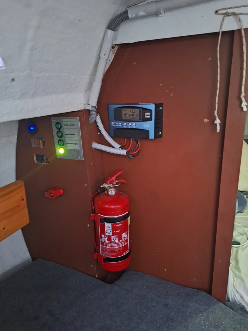 The 12 V panel, solar charge controller and fire extinguisher